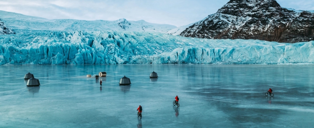 Cycling on frozen lake Remote Glacier Camp Fjallsarlon Iceland