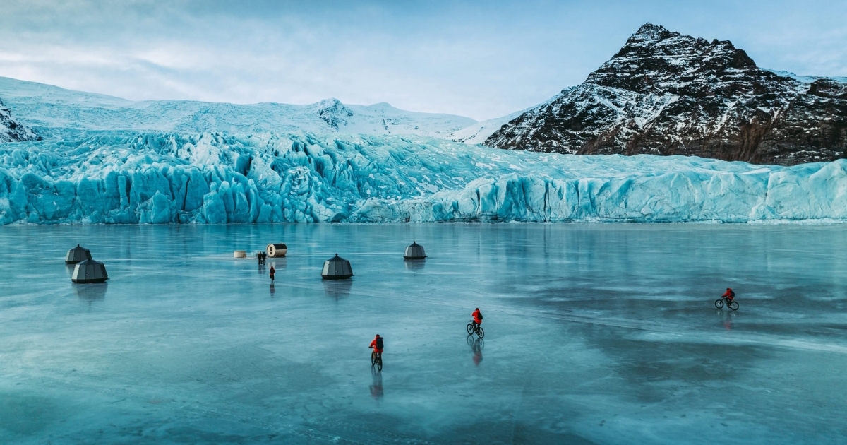 Cycling on frozen lake Remote Glacier Camp Fjallsarlon Iceland